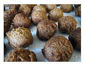 Oil. Donuts Finished And Cooling On Paper Towel lined Cookie Sheet
