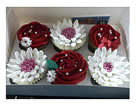 Pink Cupcake Bouquet On A Decorated Board