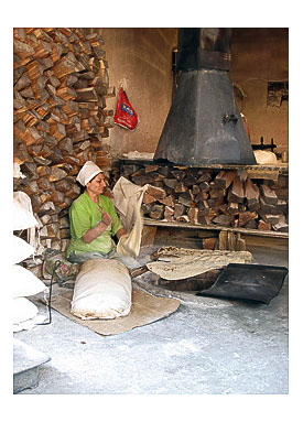 Old lady baking lavas in Yerevan