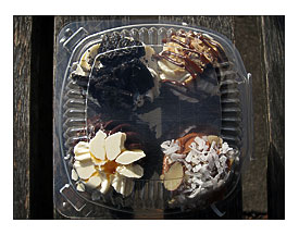 Four Cupcakes in a Plastic Container