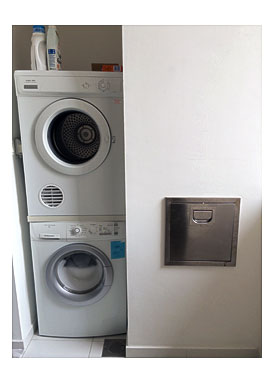 Washer, Dryer, And Trash Chute In Wet Kitchen