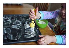 Baking Soda From A Bowl And Drop A Little Bit Into Each Cookie Cutter