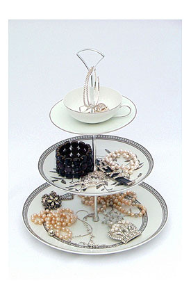 Antiquated china three tier cake stand displaying jewellery